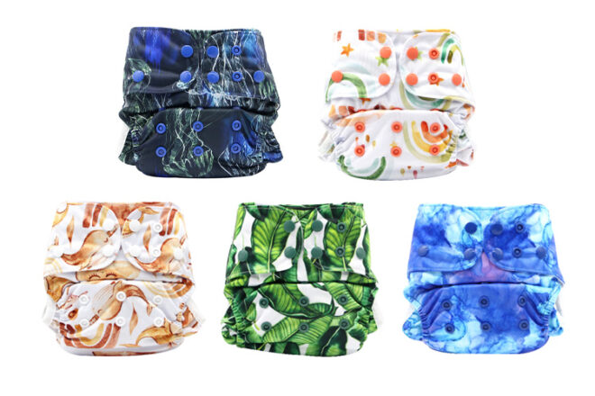Comparison of five Cloth Bums pool diapers, showing folded front views of different designs and showcasing adjustable snaps. 