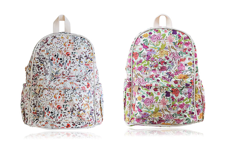 Front view of Josie Joans children's backpacks, showing two different floral prints for comparison.