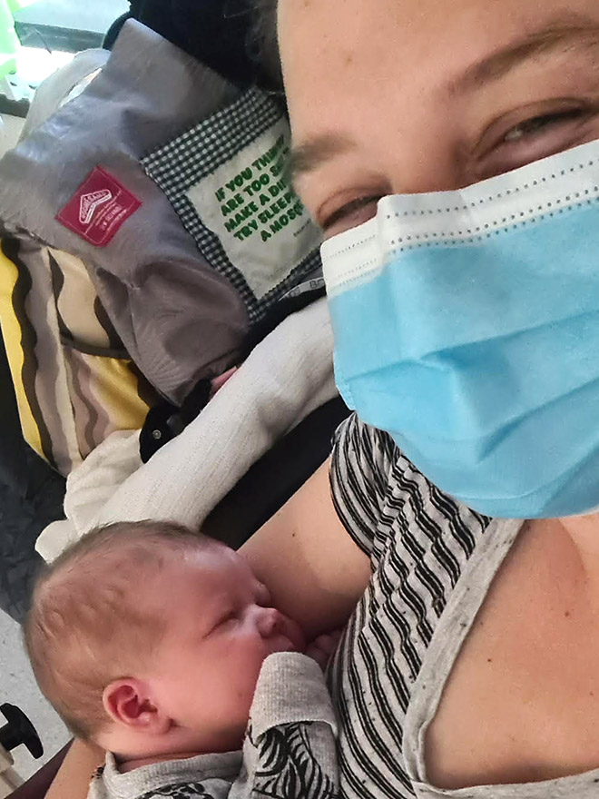 Kasey holding newborn baby James in hospital