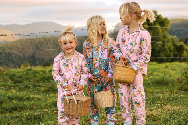 Three young girls standing in a field wearing Cotton On Easter Pjs