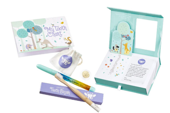 Royal Australia Mint tooth fairy kit showing items inside, including pen, toothbrush, storage box and commemorative coin.