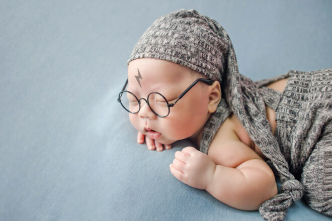 Newborn baby with glasses and Harry Potter birth mark