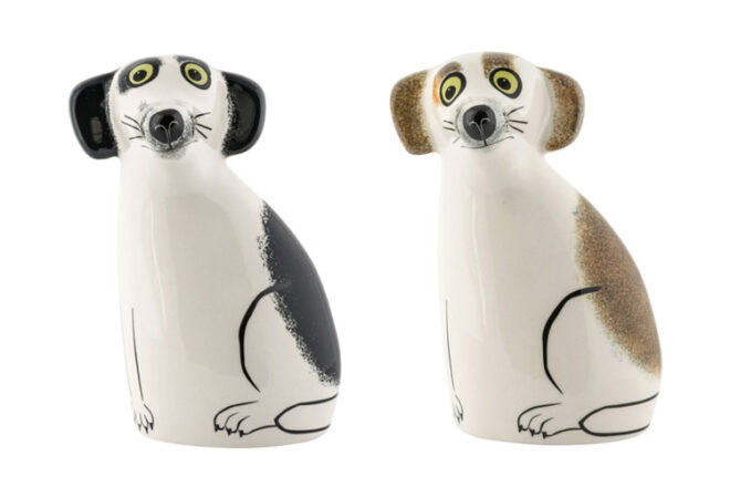 Hannah Turner Dog piggy bank showing front view of black and white and brown and white dogs