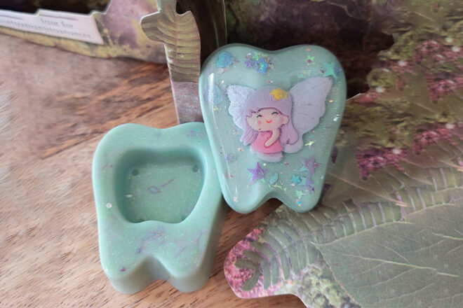 Mint green resin glittered tooth fairy box by PixieGifts showing fairy design and space for tooth or coin