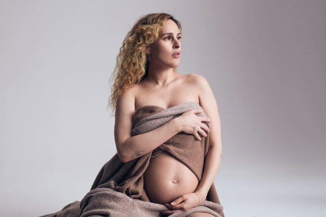 Rumer Willis posing in maternity photoshoot wrapped in a sheet