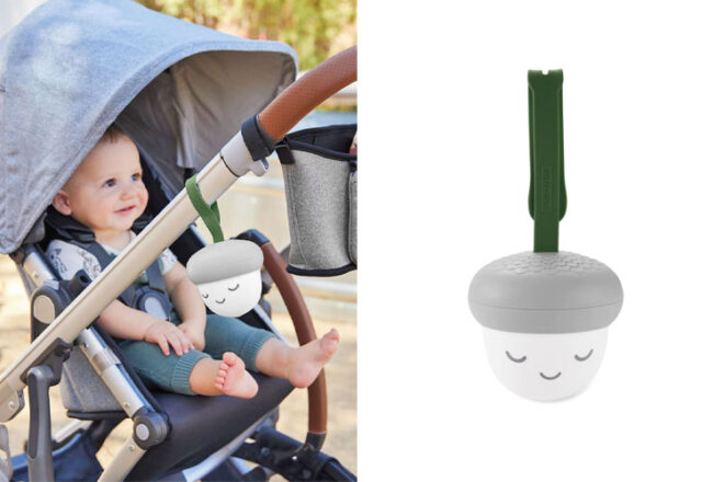 Image showing the Skip Hop Glow With Me Portable Acorn Sound Machine front on next to baby in pram with the white noise machine attached
