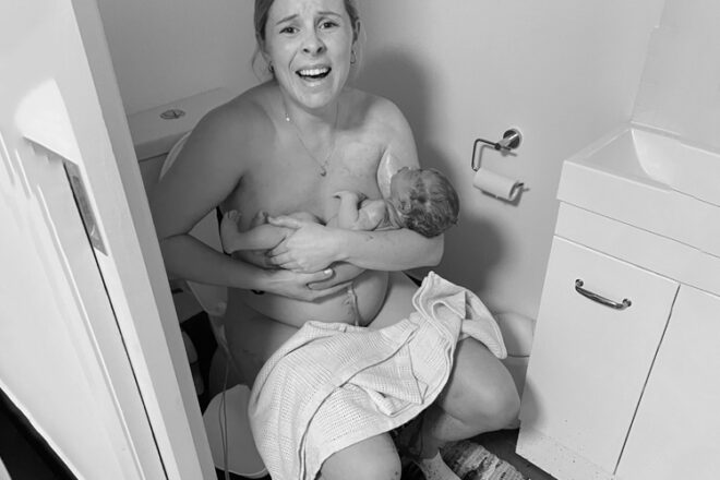 Stephanie sitting on the toilet just after giving birth