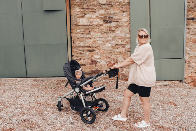 Aimie walking with her Bumbleride Era pram and daughter