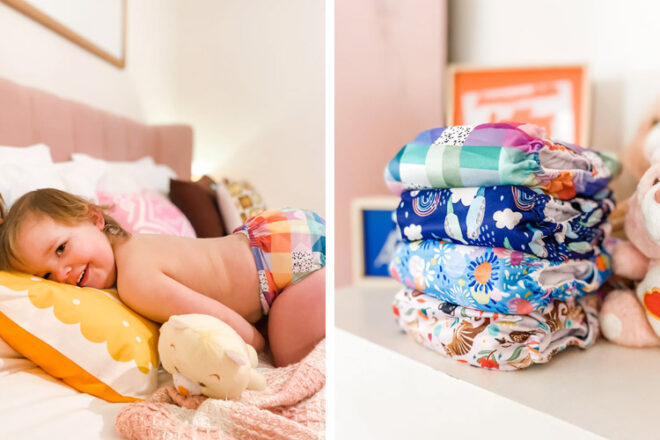Little girl on bed wearing a pair of Cloth & Crown modern cloth nappies alongside a stack of nappies in different designs