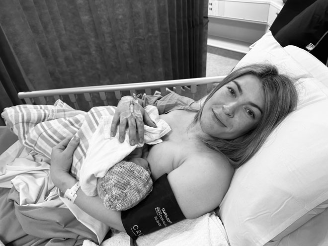 Olivia in hospital breastfeeding her baby
