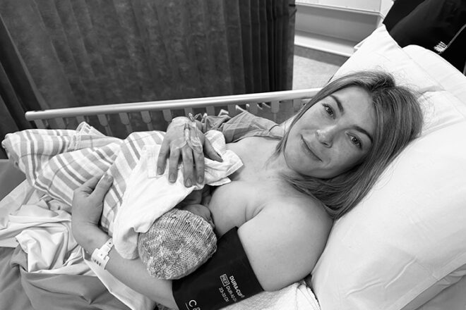 Olivia in hospital bed doing skin to skin contact with her newborn