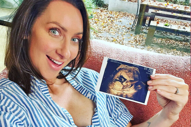 Gogglebox Australia star Isabelle Silbery holding an ultrasound photo
