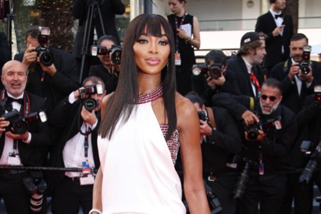 Supermodel Naomi Campbell posing in front of the cameras