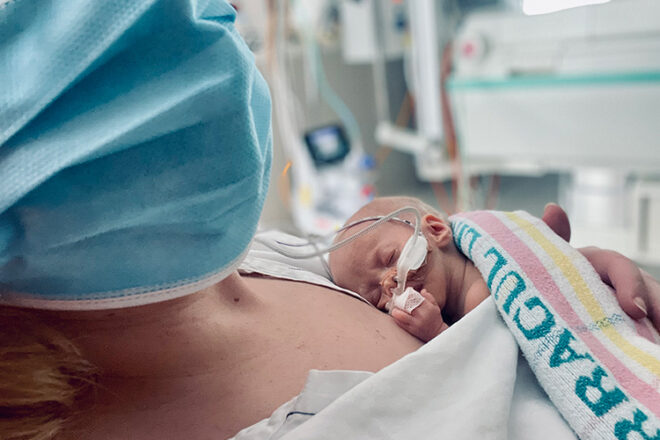 Tamra holding tiny baby in hospital