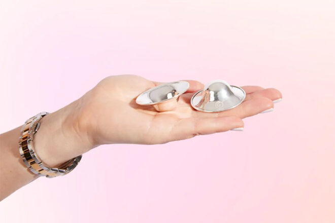 Bubka silverlettes held in a woman's hand on pink background showing design and size.