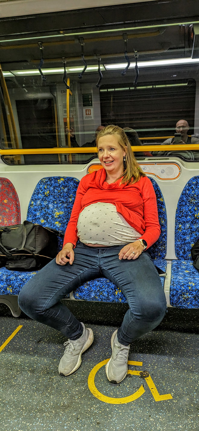 Cara heavily pregnant on public transport