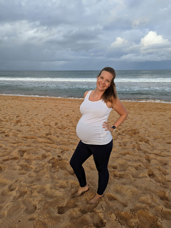 Cara pregnant on the beach