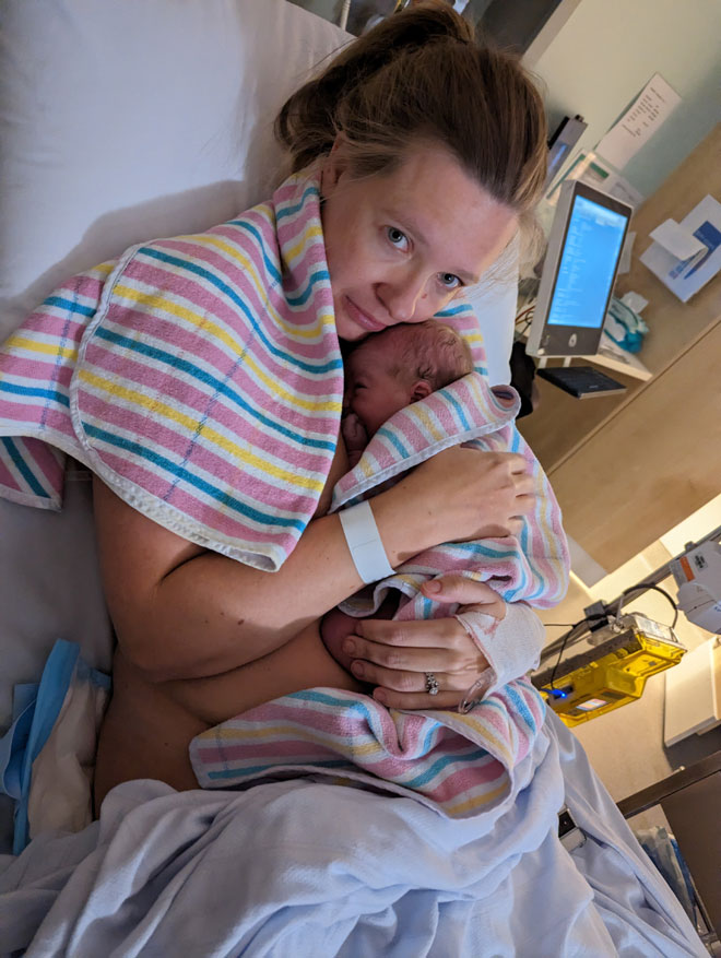 Cara holding newborn Jack