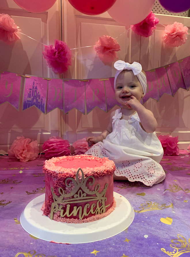 Skye eats cake for her 1st birthday