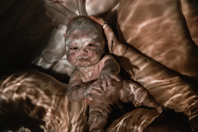 A newly born baby underwater after the water birth