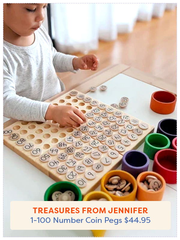 young girl putting 1-100 coin pegs into a board