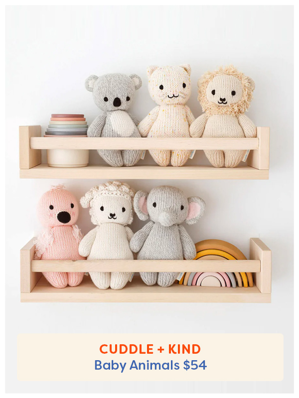 The Cuddle + Kind Baby Stuffed Animals on two shelves with other silicone stacking toys