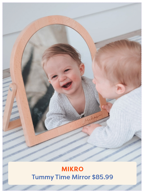 baby looking in a Mikro mirror while doing tummy time