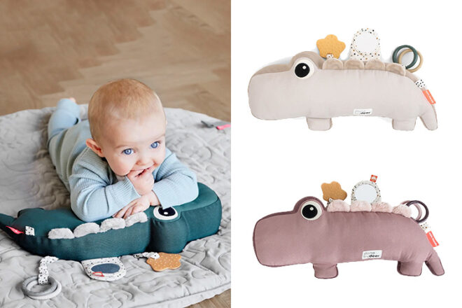 baby lying on crocodile tummy time pillow showing three different colour ways