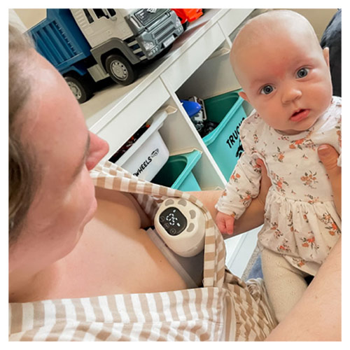 Mum using the Welcare Nurture Wearable Electric Breast Pump while playing with baby