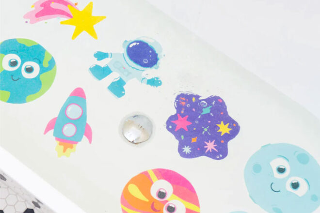 The Jellystone Designs Galaxy Bath Grips in use in a bath full of water