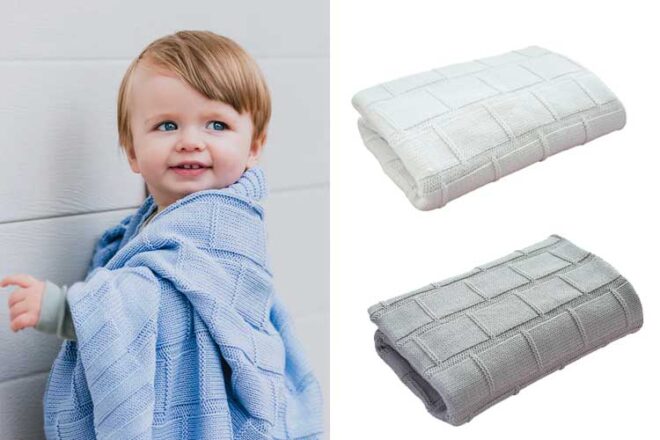 Little toddler boy wrapped in a baby blue blanket next to two other colourways of folded baby blankets