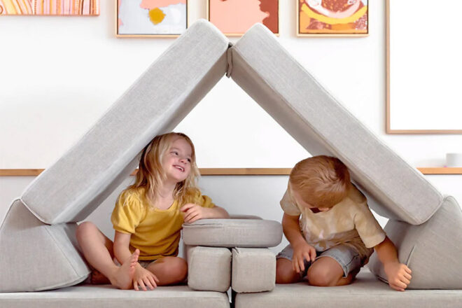 two young children in a cubby build from My Nook play couch