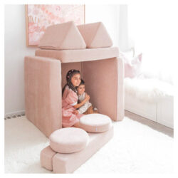Two children sitting inside a fort built with the My NooK play couch