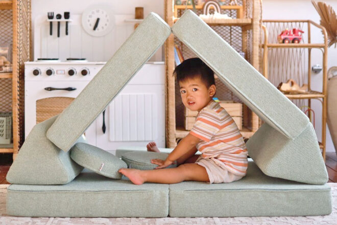 Child sitting in the My NooK Junior play couch