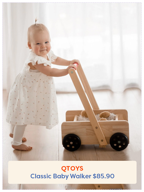 Young Baby walking holding on to the Qtoys baby walker