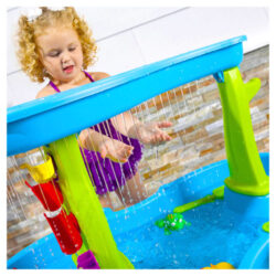 A close up view of a child playing with the Step 2 Direct rain showers splash pond water table