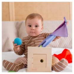 A baby playing with the Totli Surprise Box