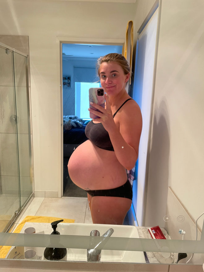 Bree takes a pregnant selfie in the mirror