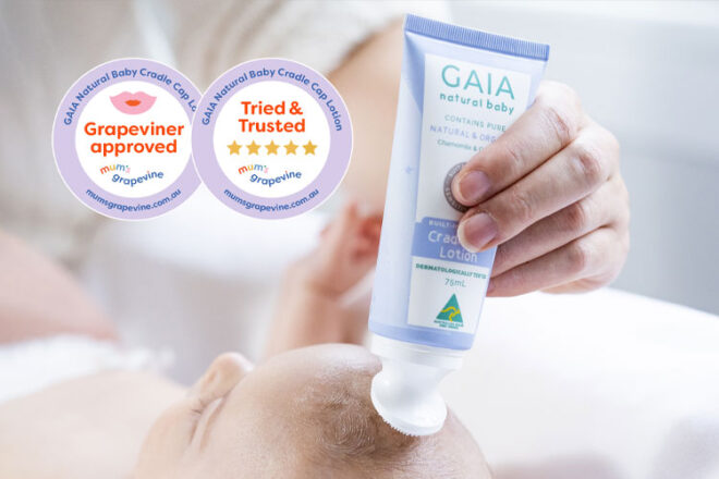Mother applying GAIA Cradle Cap Lotion to her baby's scalp