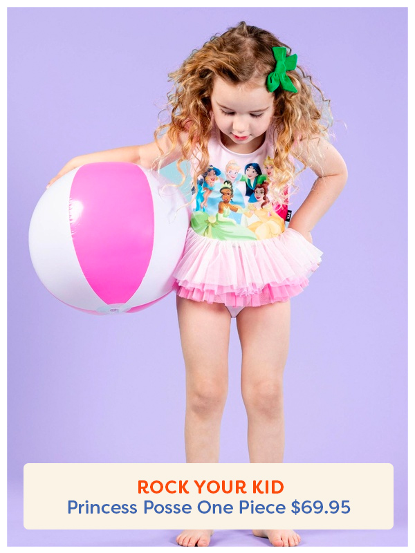 young girl with a beachball looking down at her Rock Your Kid princes tulle one piece swimsuit