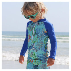 Young boy wearing Tribe Tropical rash suit