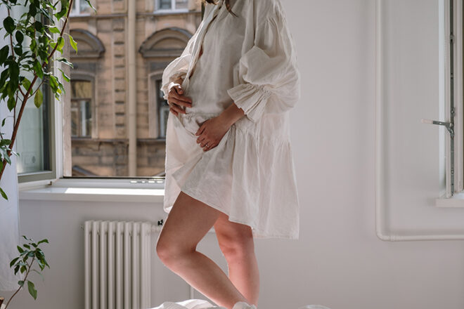 pregnant woman in a window