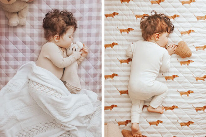 Two babies asleep on top of the Bambella Designs waterproof cot sheets