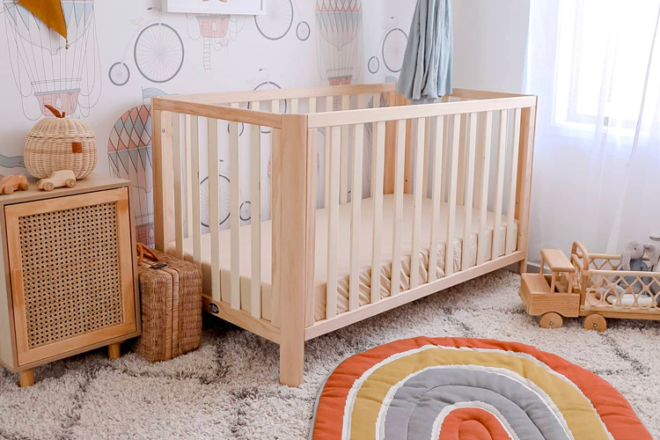 Baby nursery cot set up with a sand fitted cot sheet from Bubba Bump