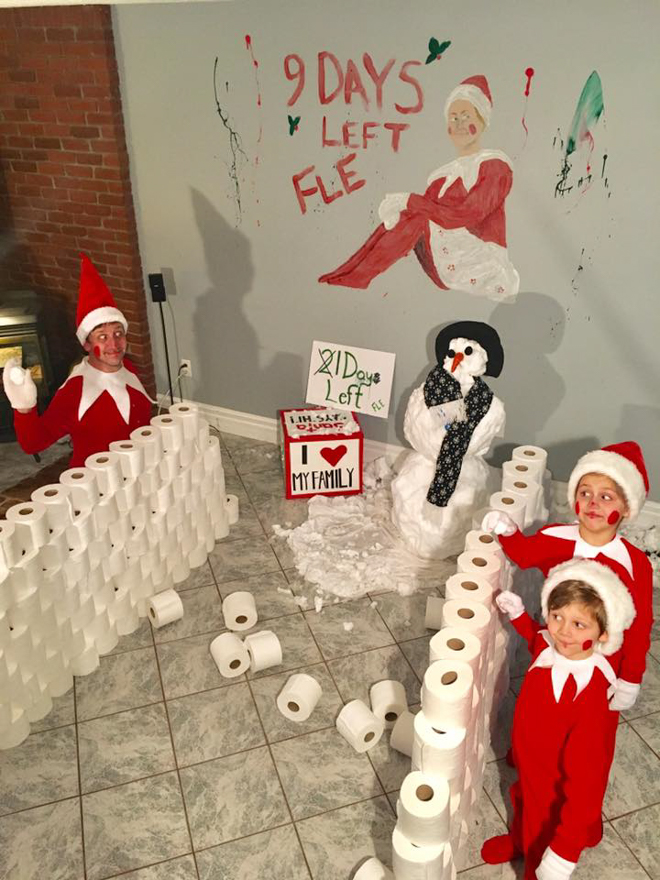 Family of elves makes wall of toilet paper with snowman melting 