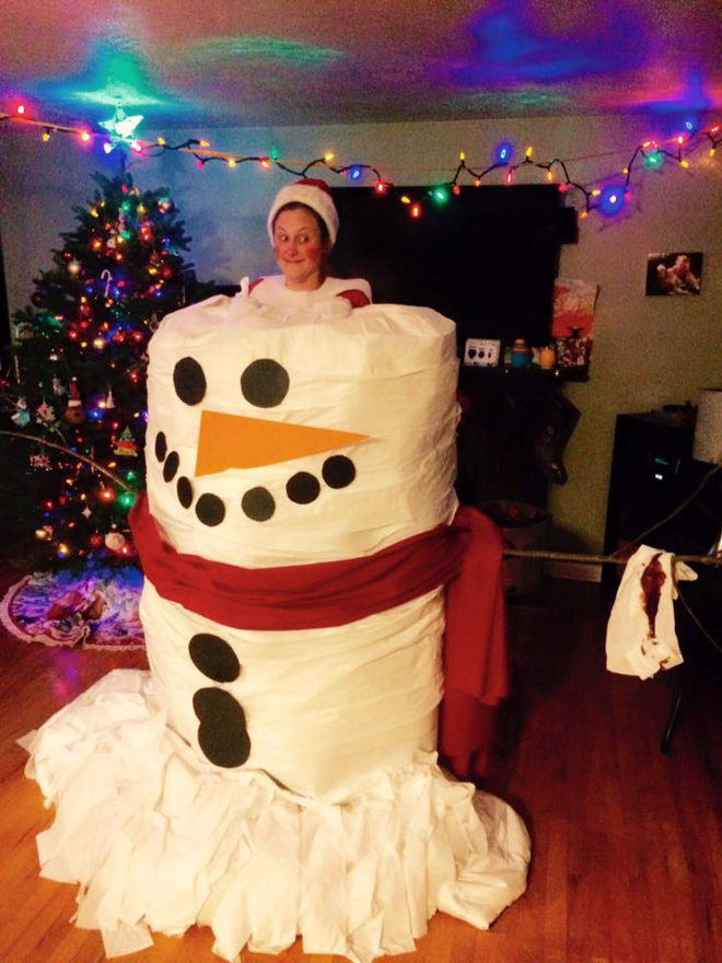 Dad dresses as elf on the shelf whilst inside a giant marshmallow as large as he is