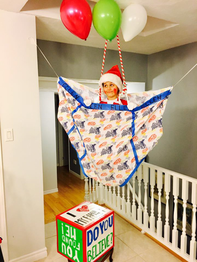 Child dresses as elf on the shelf sitting in a floating pair of underwear