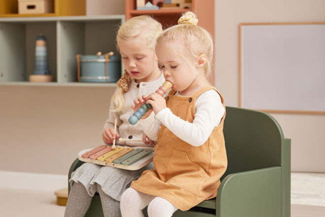 Two children playing with the FLEXA Xylophone and Recorder Musical Instruments