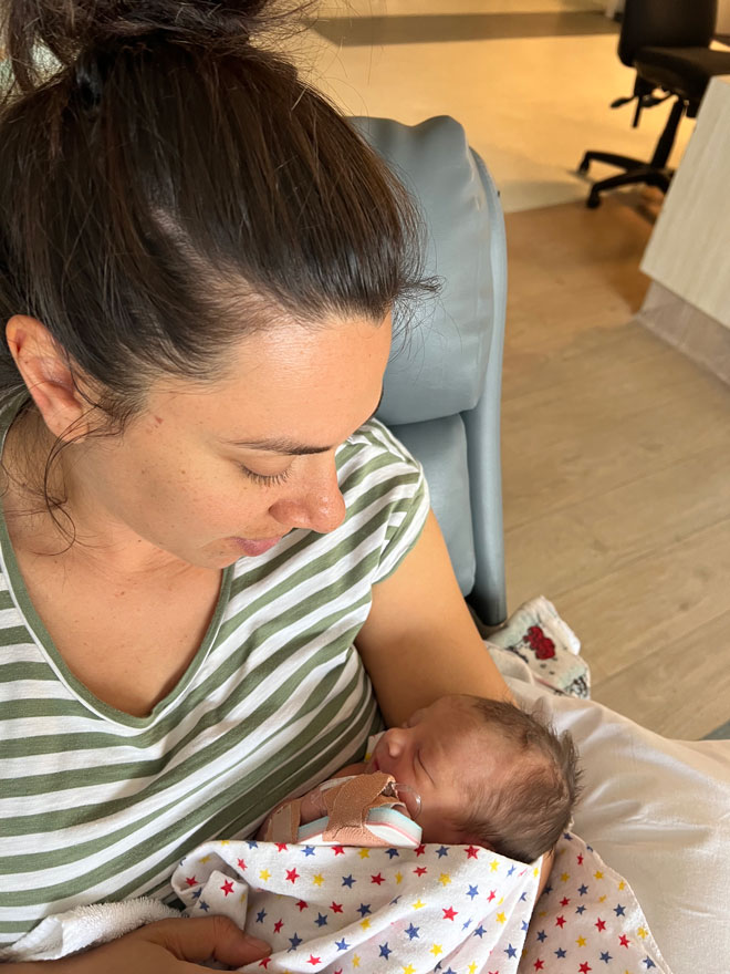 Laura holds her baby for the first time