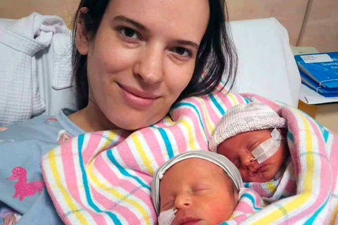 Rebecca holds her newborn twins